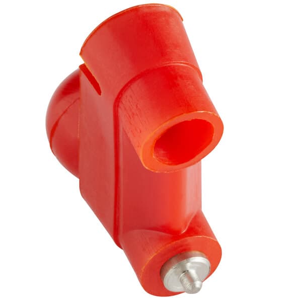 A red plastic pipe with a metal end and a hole.